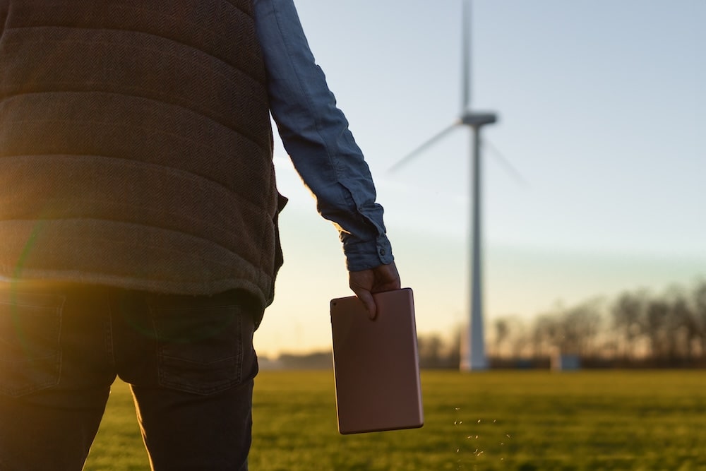 businessman checking on wind turbine energy produc 2024 01 23 13 54 53 utc min